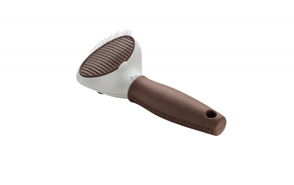 Selbstreinigende HUNTER Zupfbürste Spa mit komfortablem Griff und feinen Metallborsten zur Entfernung von Unterwolle bei Hunden.