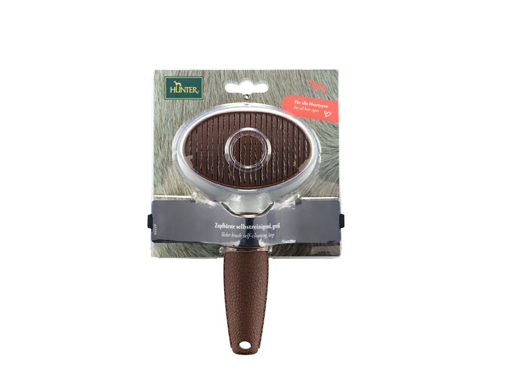 Verpackte HUNTER Zupfbürste Spa selbstreinigend mit Sichtfenster und Markenlogo, perfekt für den Einzelhandel im Bereich Hundepflege.